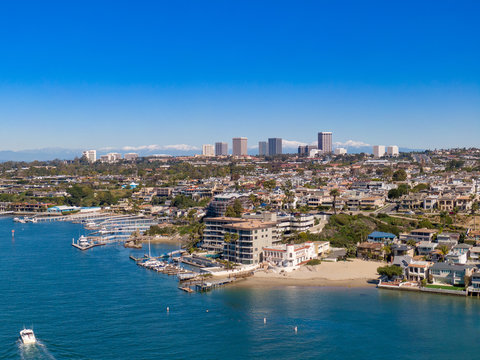 Aerial view of Newport Beach's curving harbor and Balboa Peninsula